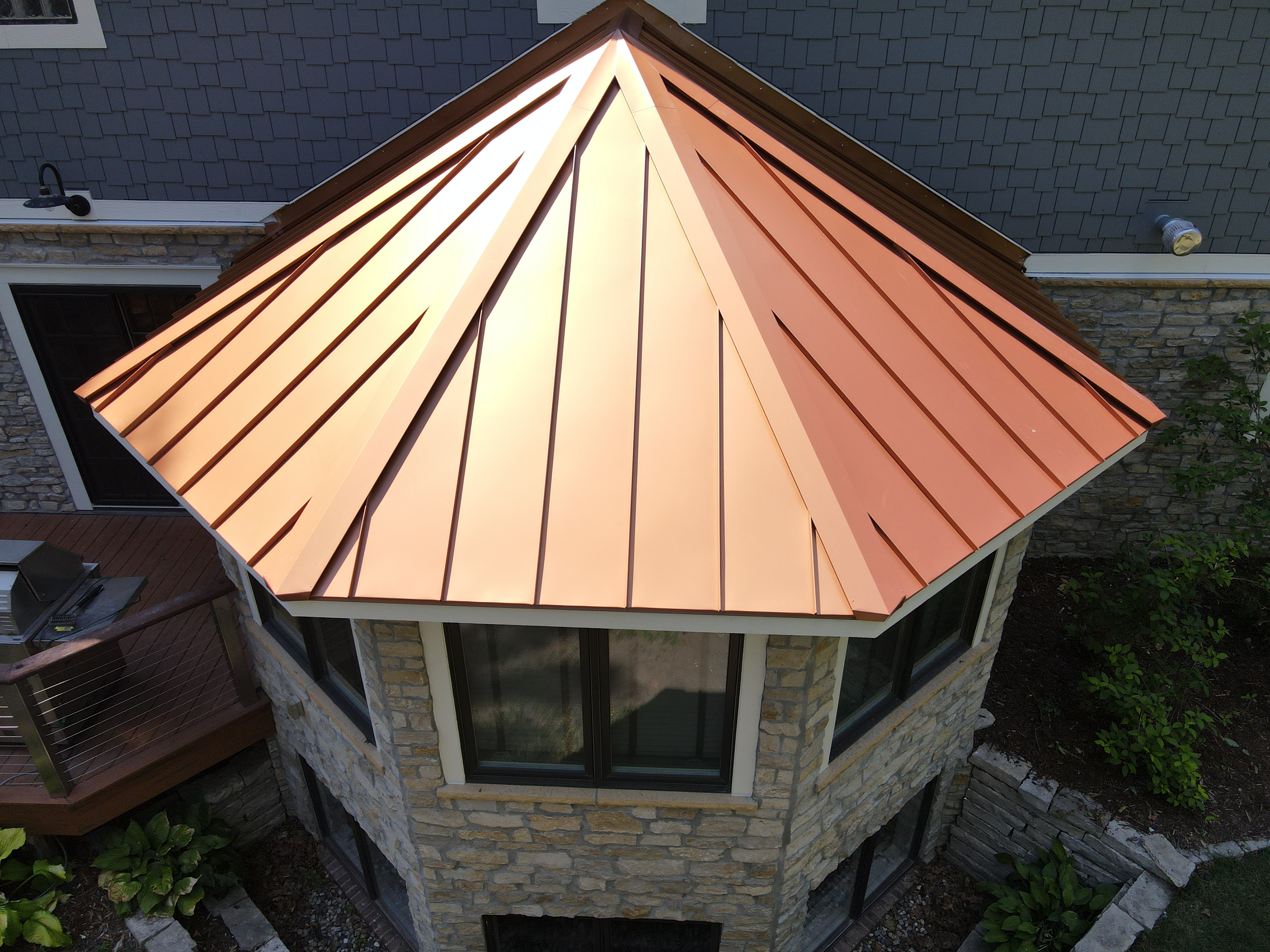 Home exterior with copper roof accent