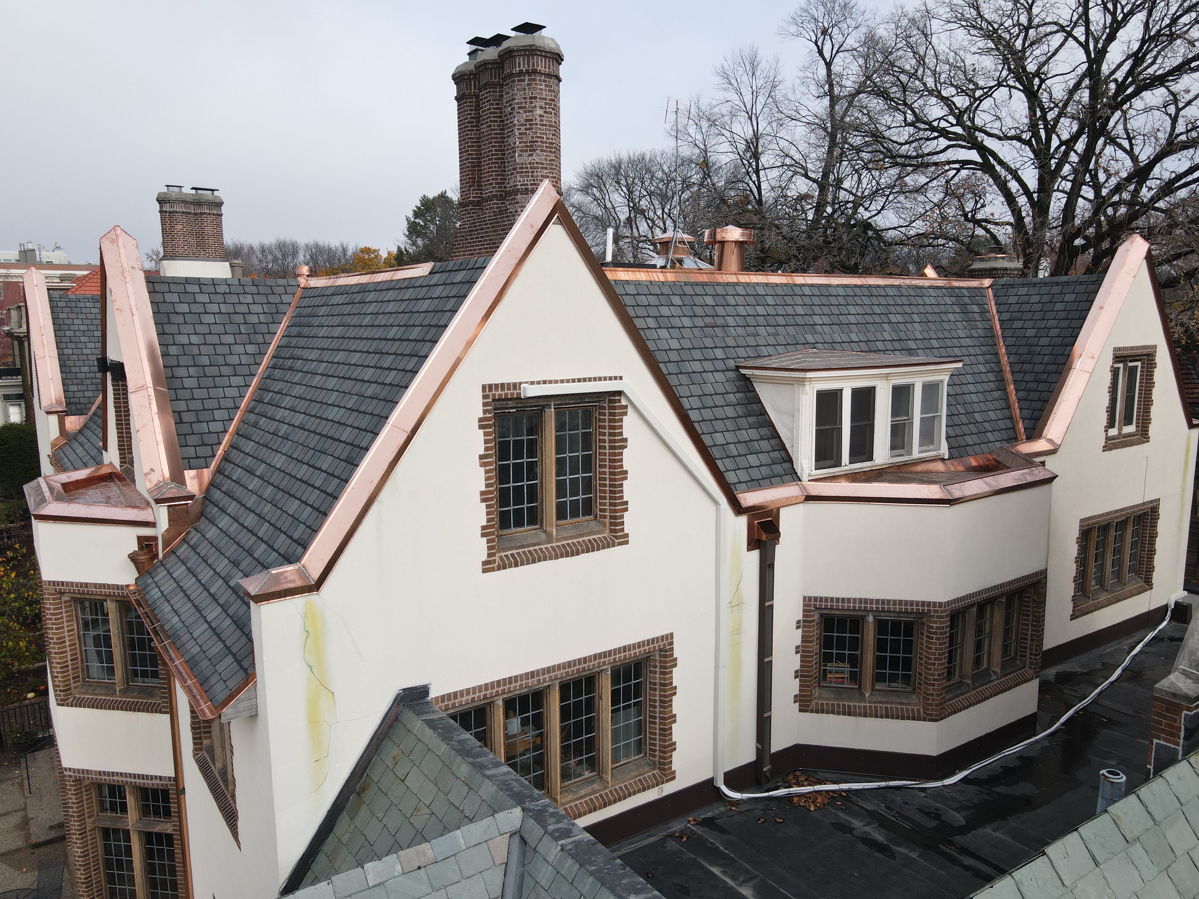 Home exterior with copper roof accent