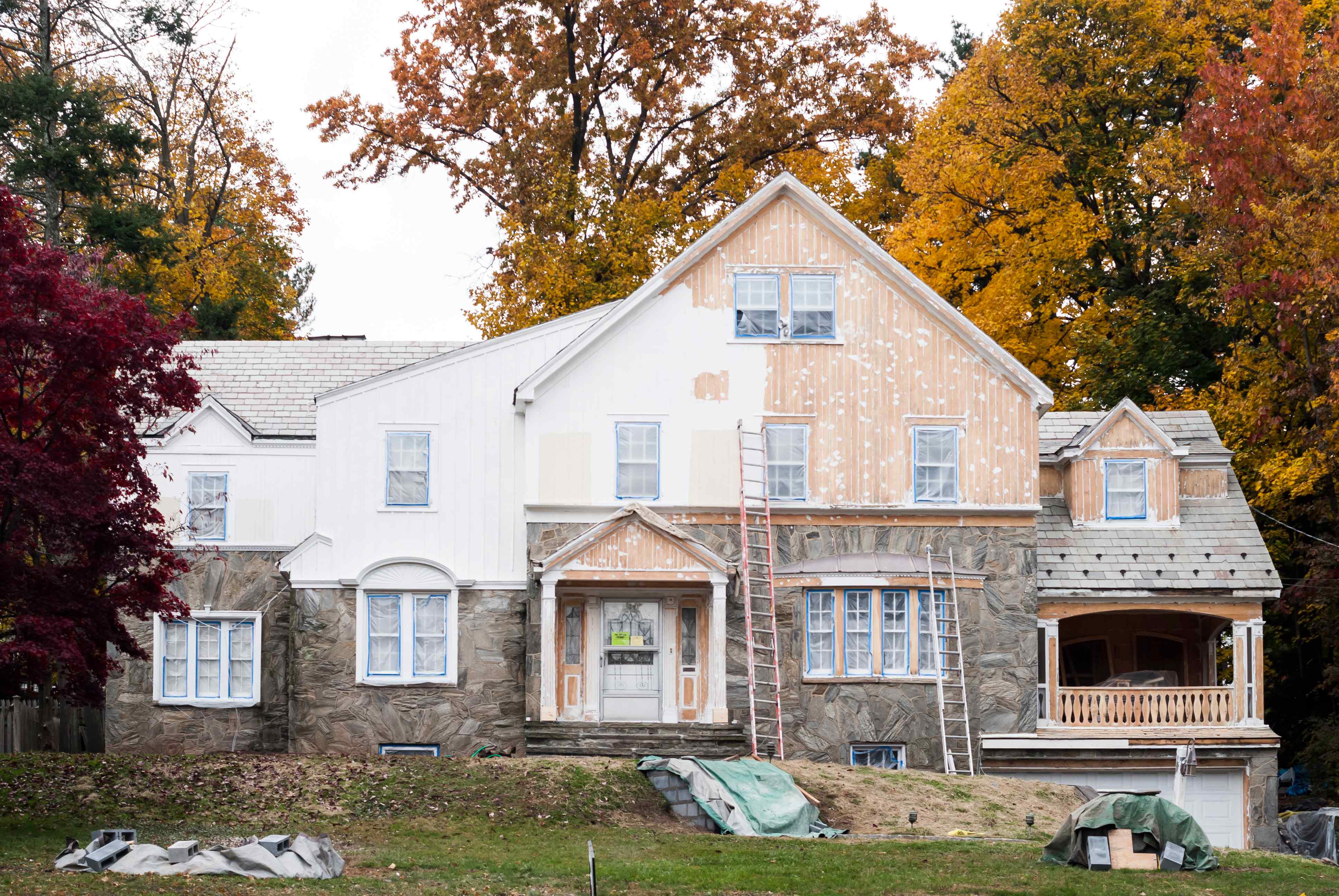 Exterior house painting with autumn scenery